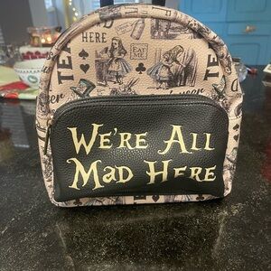 Hot Topic Tan and Black Alice in Wonderland Backpack
